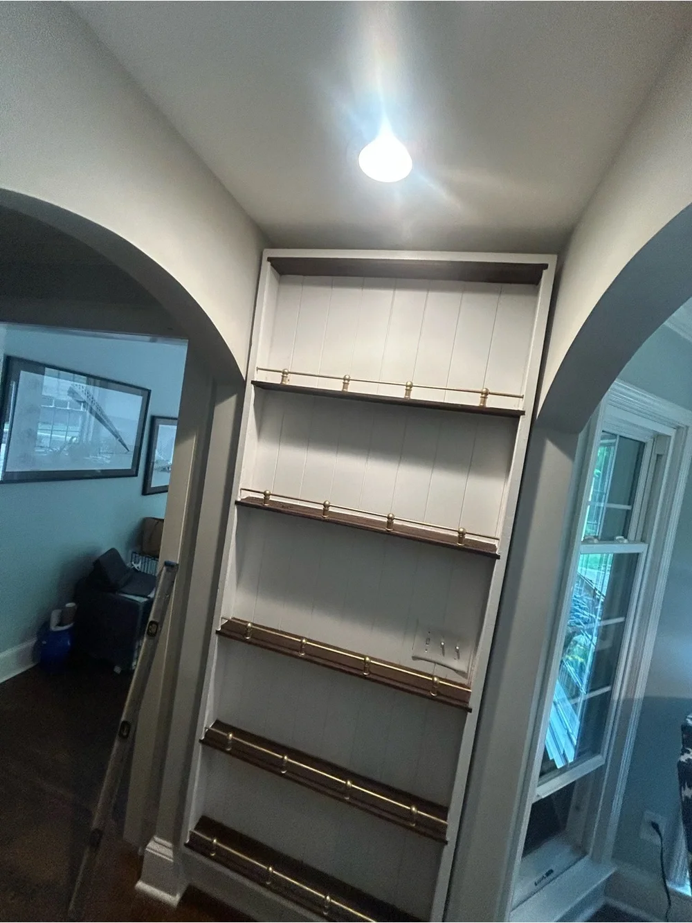 Built-in Wall Shelf with Brass Rail Accents - White and Dark Wood